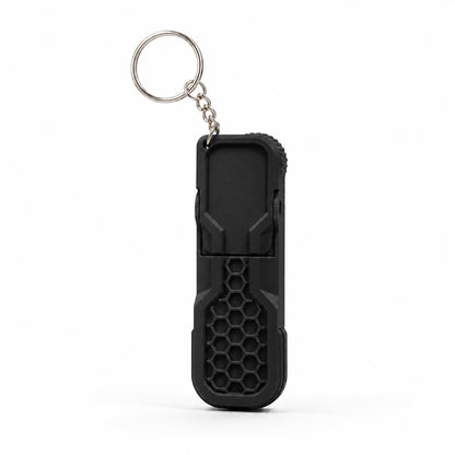 Black fidget phone stand keychain with honeycomb texture and metal keyring