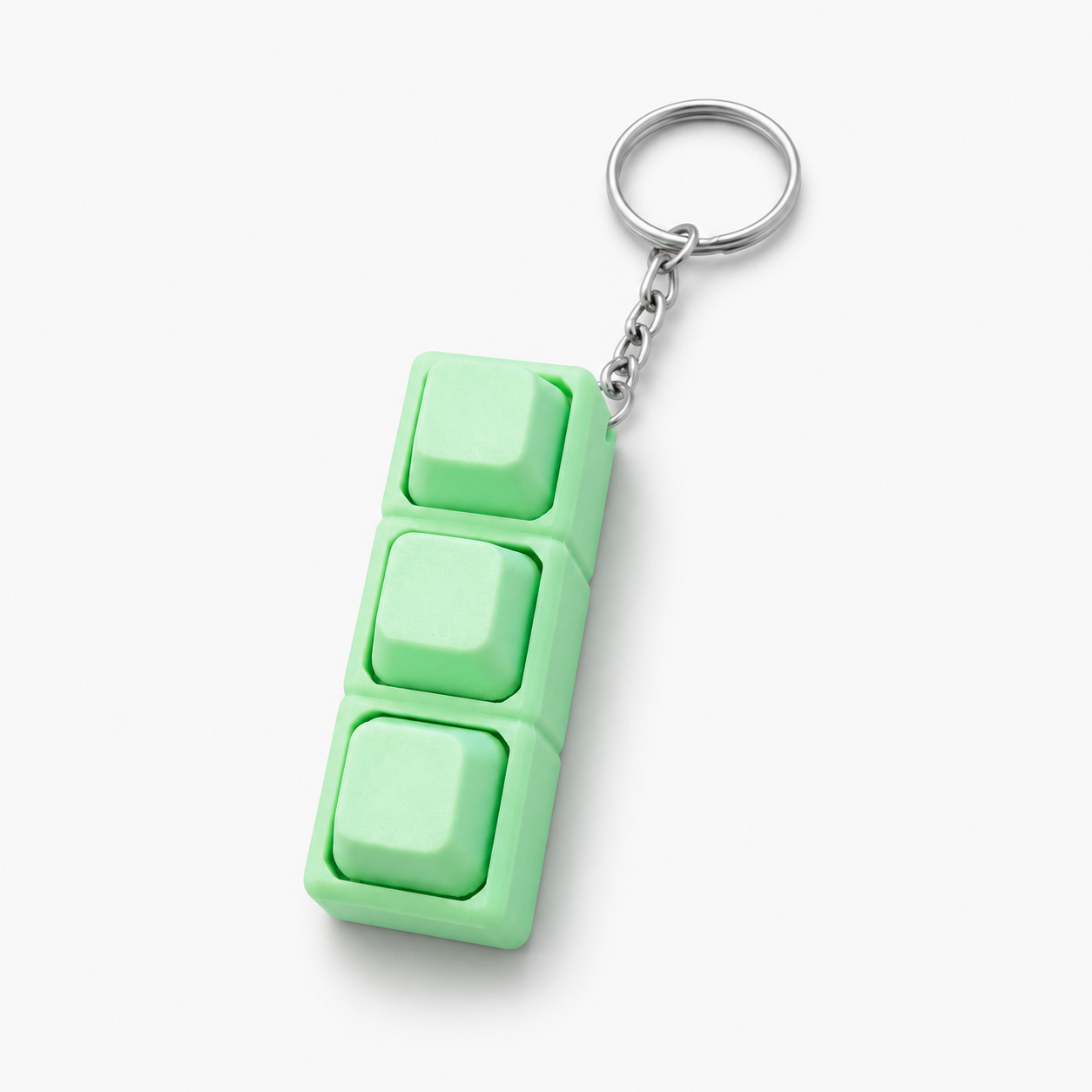 Green custom 3D printed keyboard keycap keychain on white background by DMV Print Lab