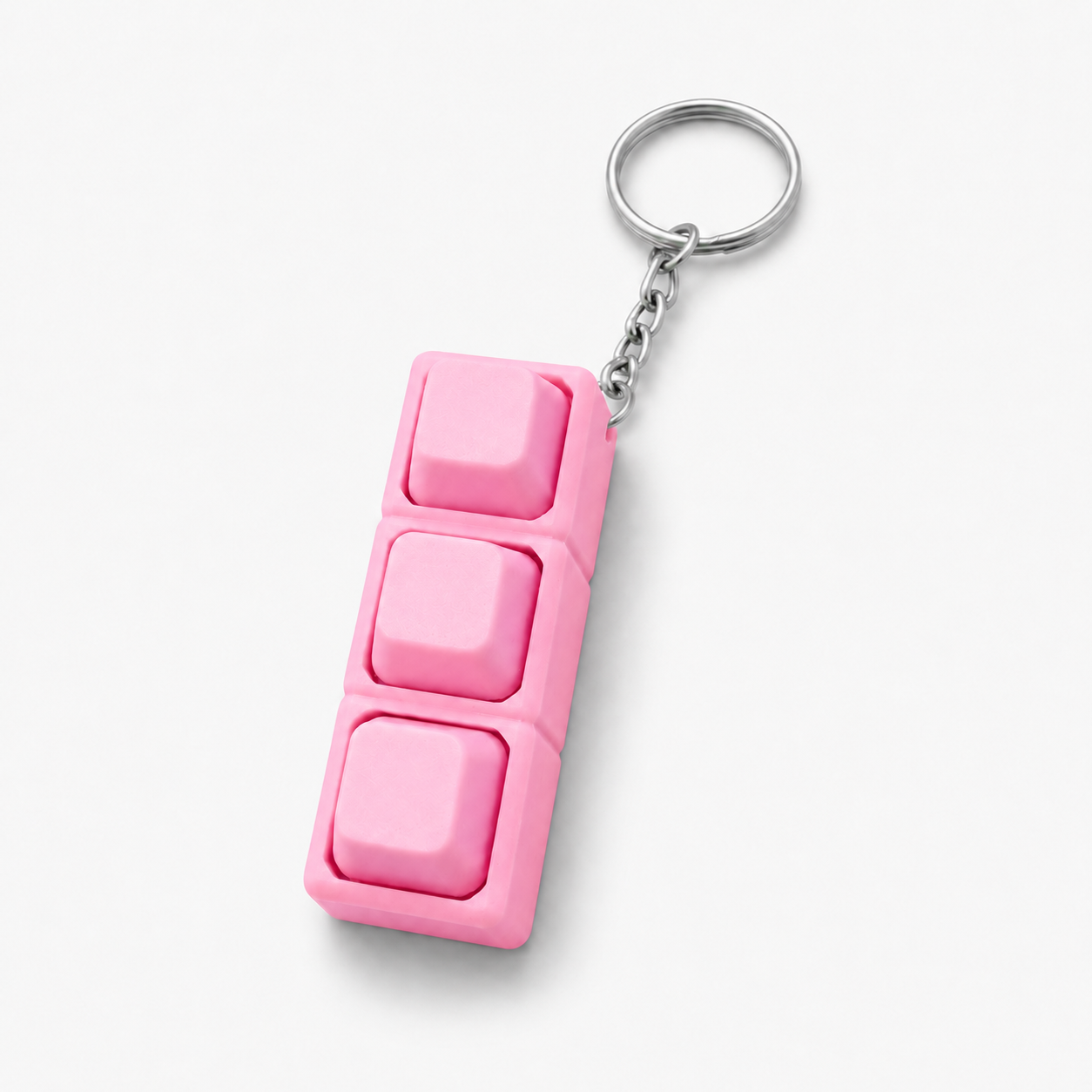 Pink custom 3D printed keyboard keycap keychain on white background by DMV Print Lab