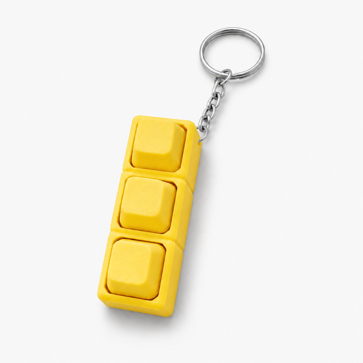 Yellow custom 3D printed keyboard keycap keychain on white background by DMV Print Lab